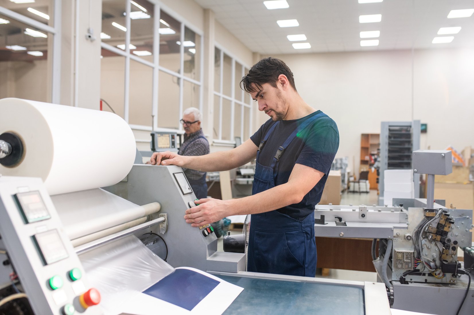 Printing press operator at work